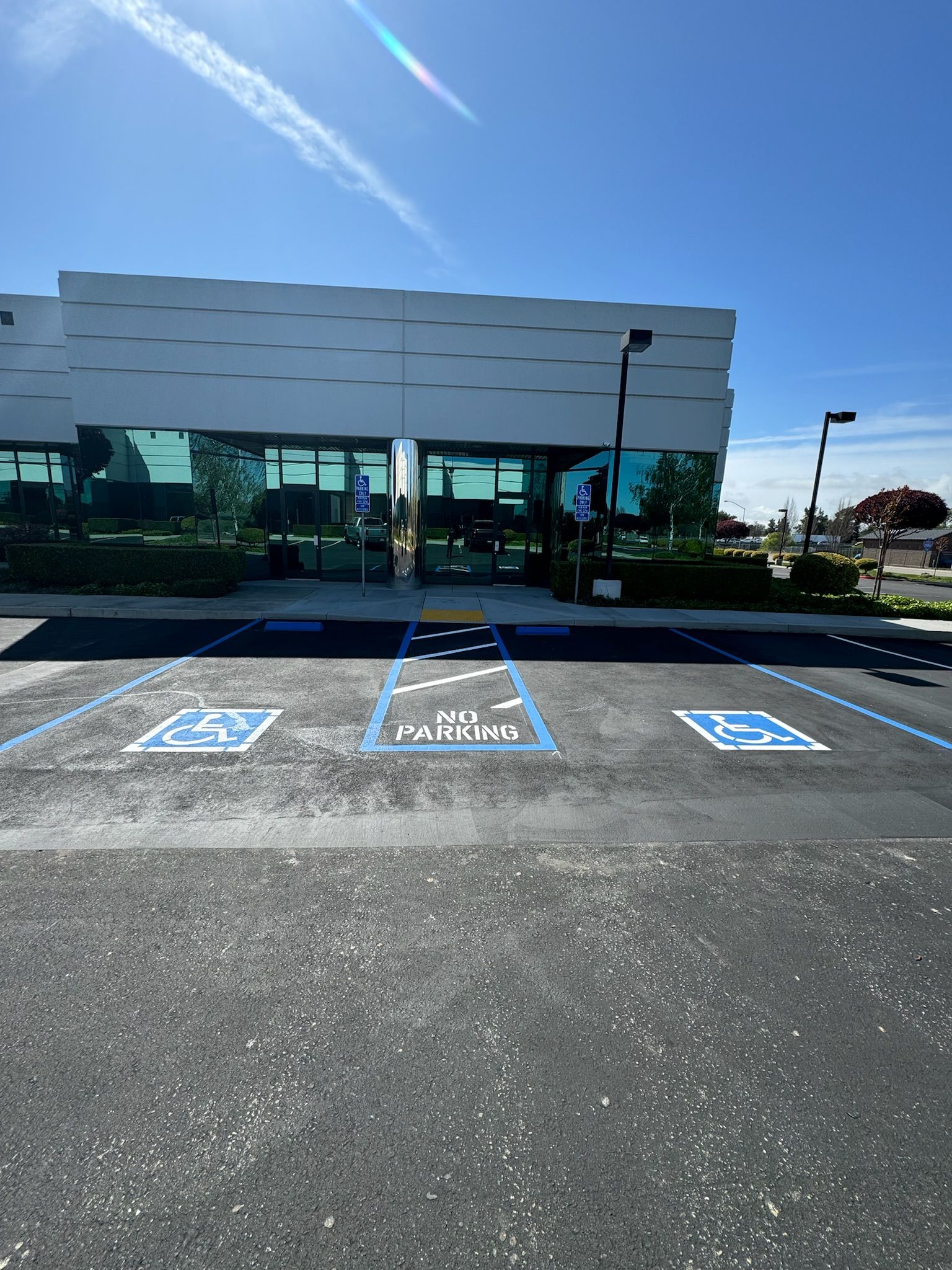 A handicapped parking spot in front of a building