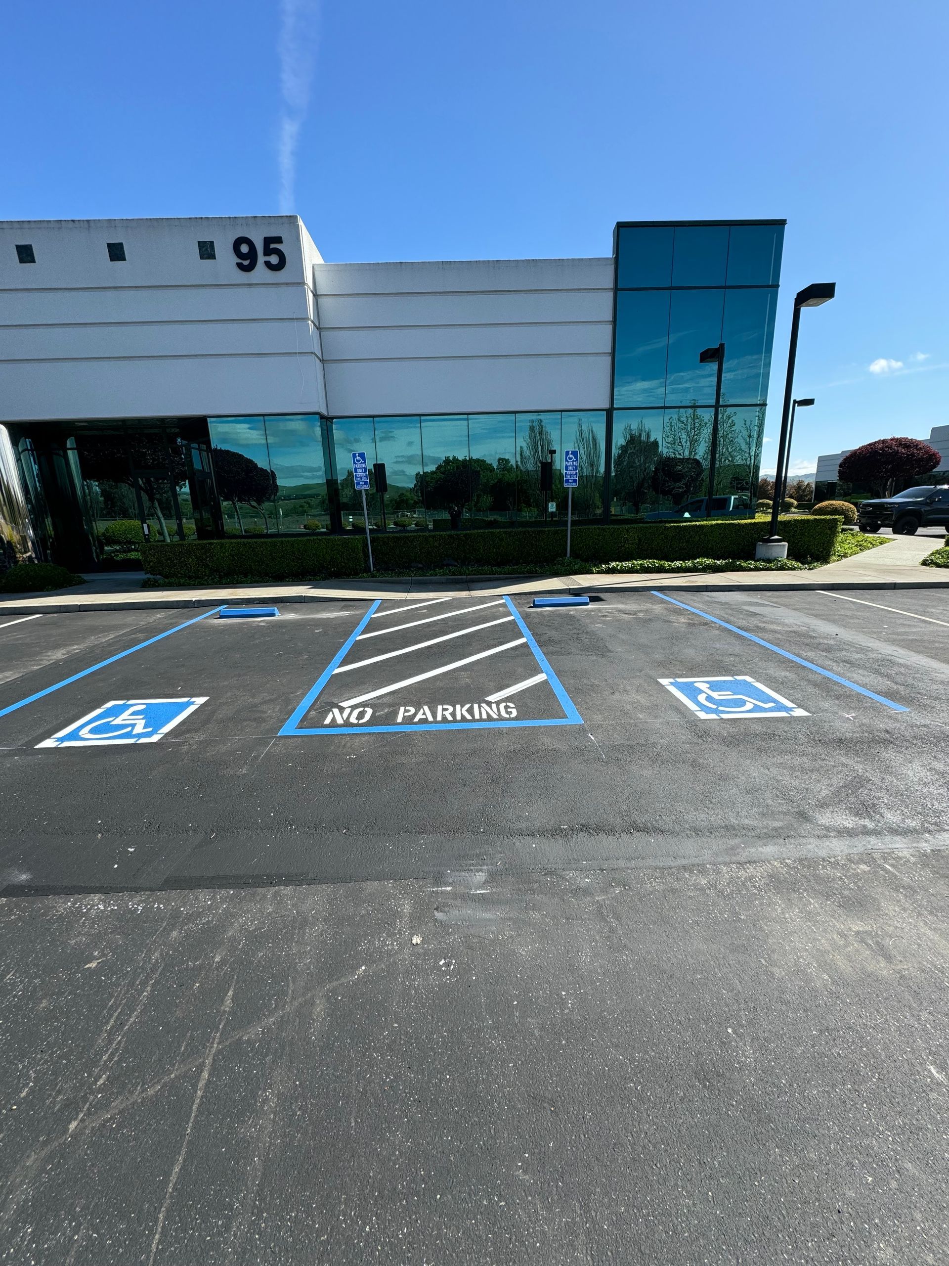A handicapped parking spot in front of a building