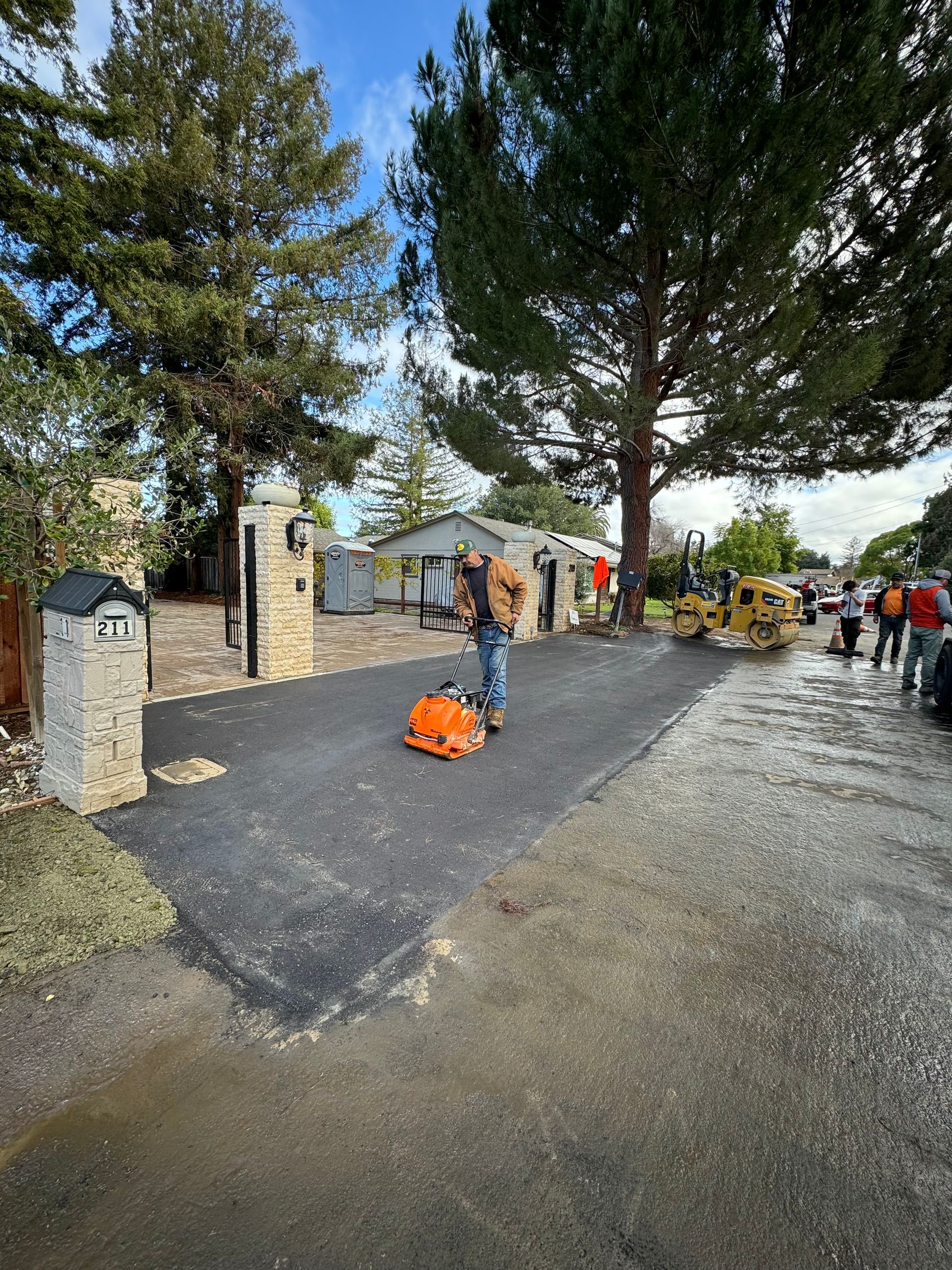 A man is standing on the side of a road.