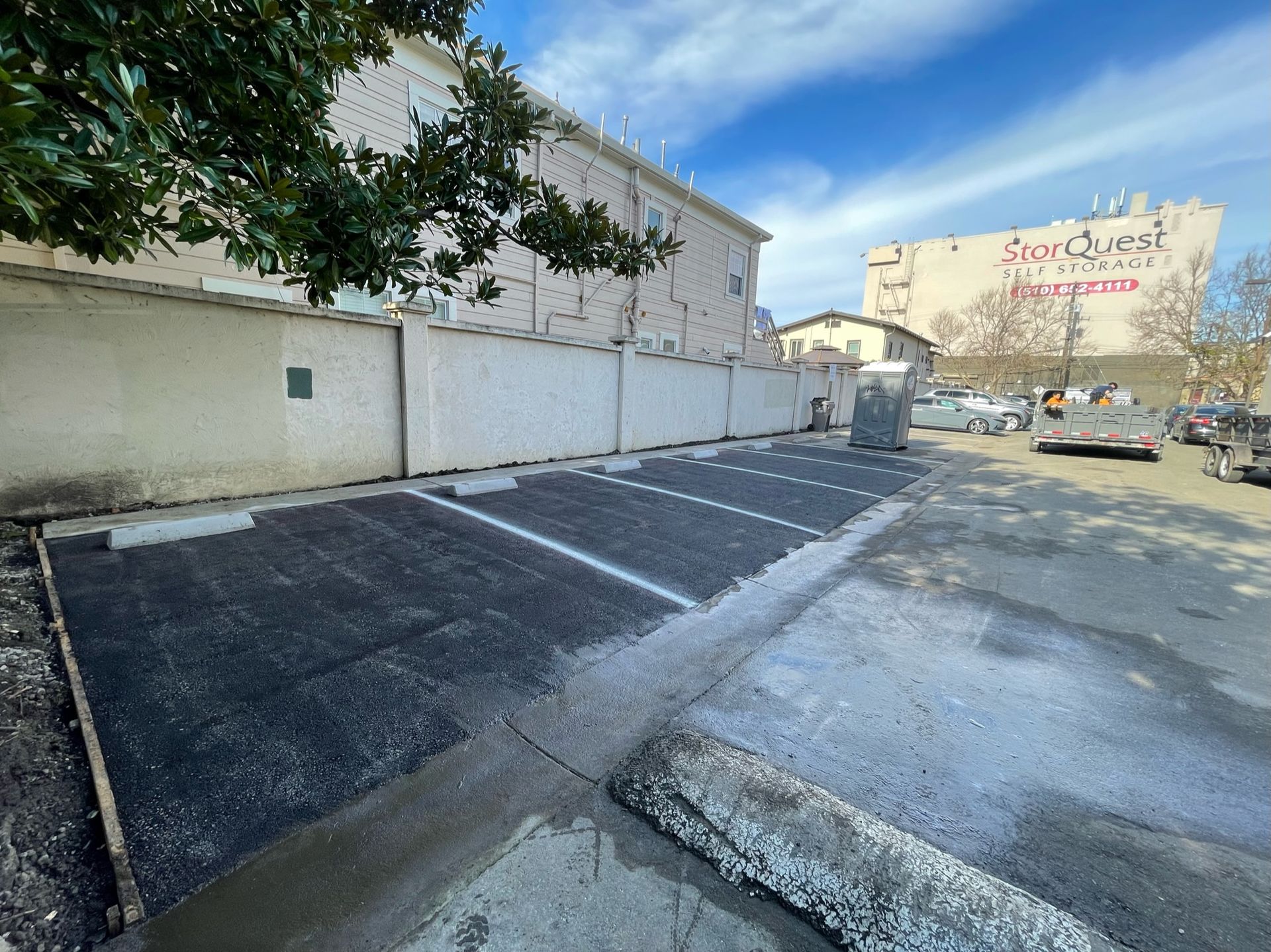 A parking lot with a large building in the background