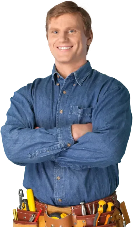 Smiling handyman with arms crossed, wearing a denim shirt and tool belt.