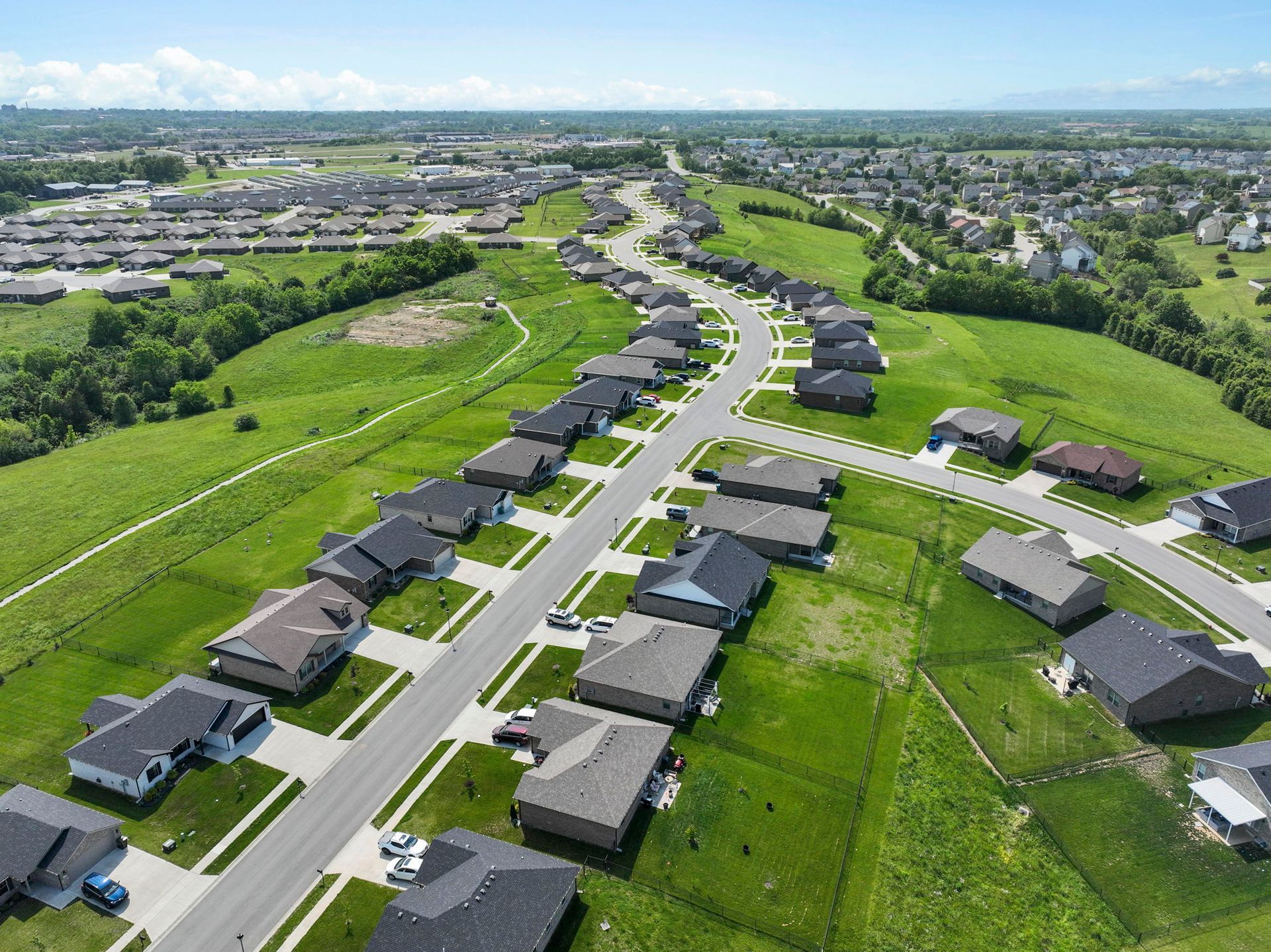 An aerial view of a residential area with lots of houses