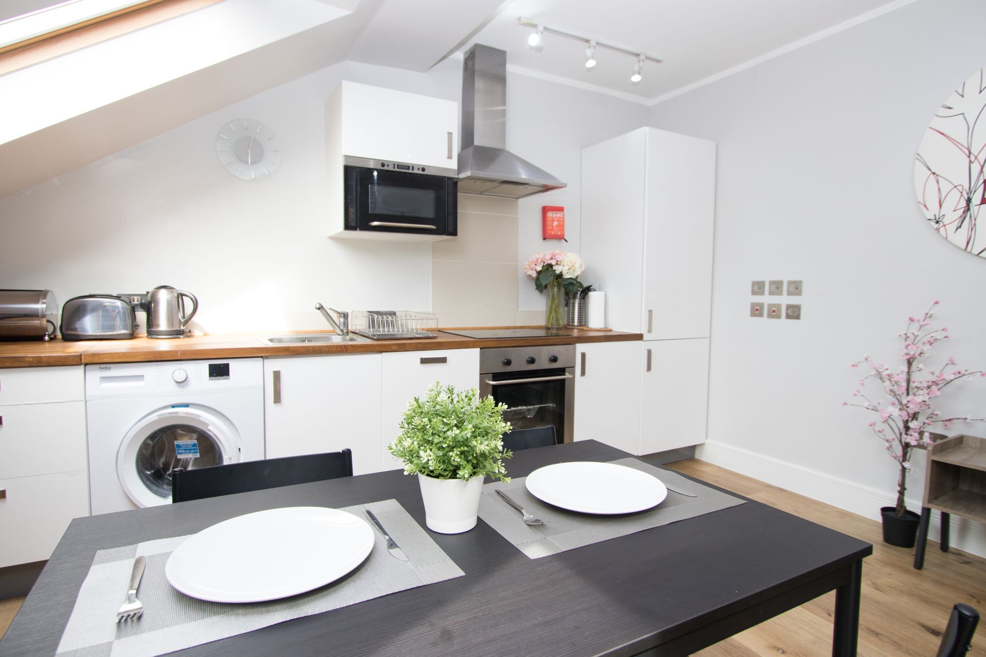 A kitchen with a table and plates on it