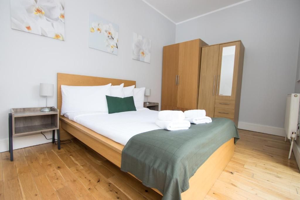 There is a large bed in the middle of the room.