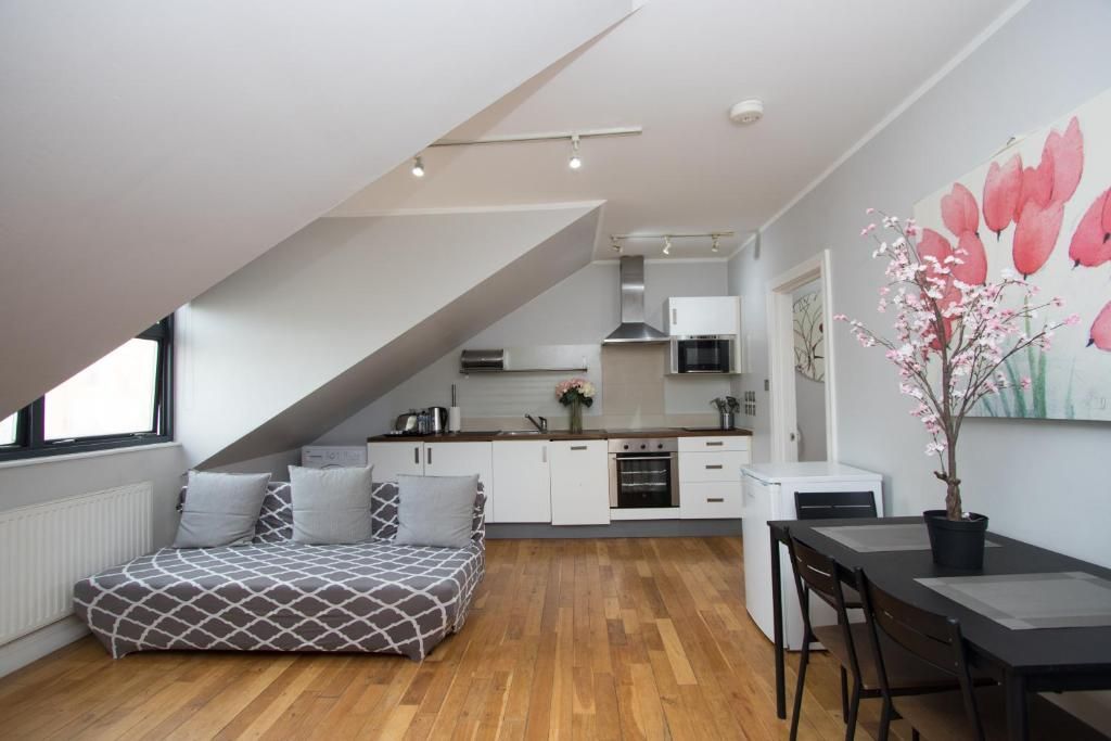 A living room with a couch and a table in it
