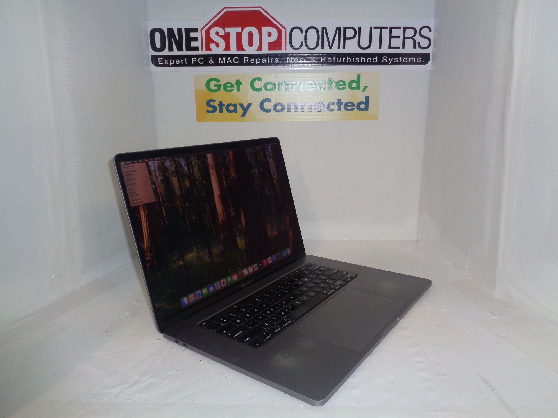 Laptop on display in front of a banner for 