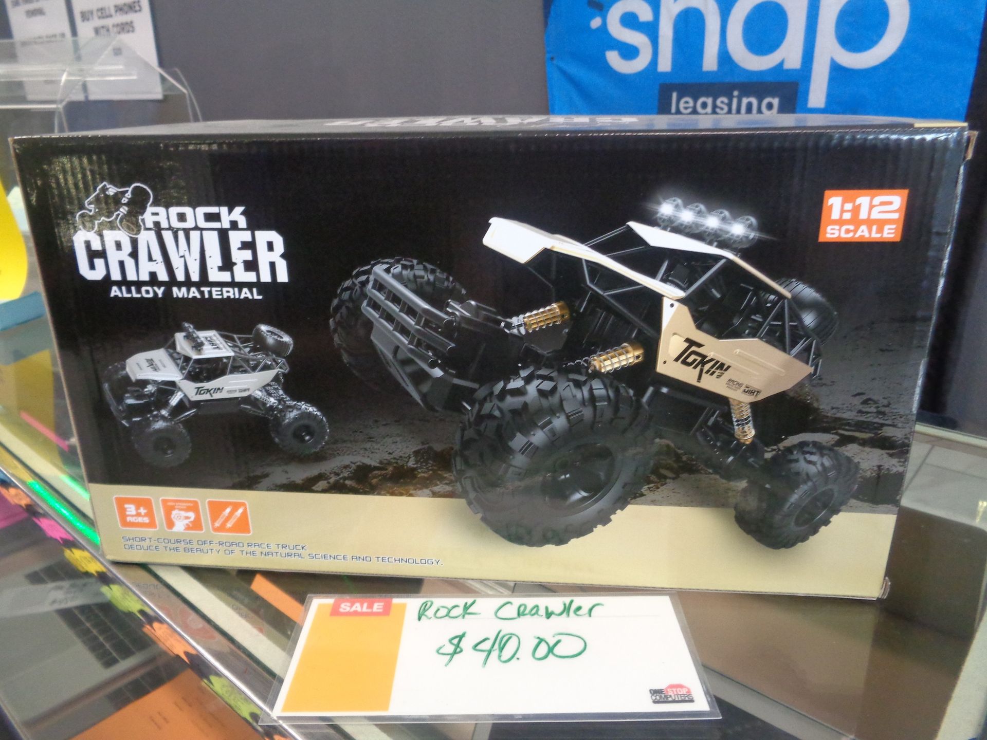 Rock Crawler toy car in box, with sale sign for $40.00. Black and gold colors. 1:12 scale.