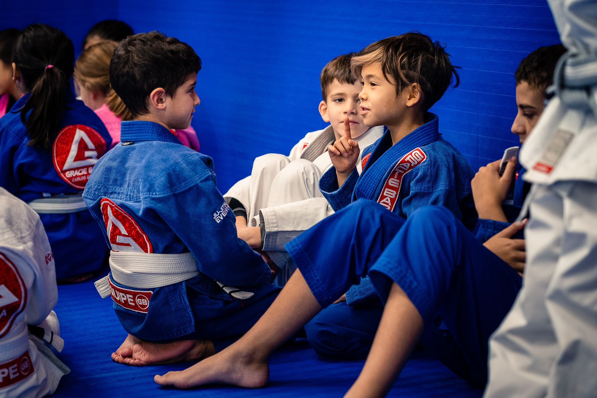 A group of young kids socializing.