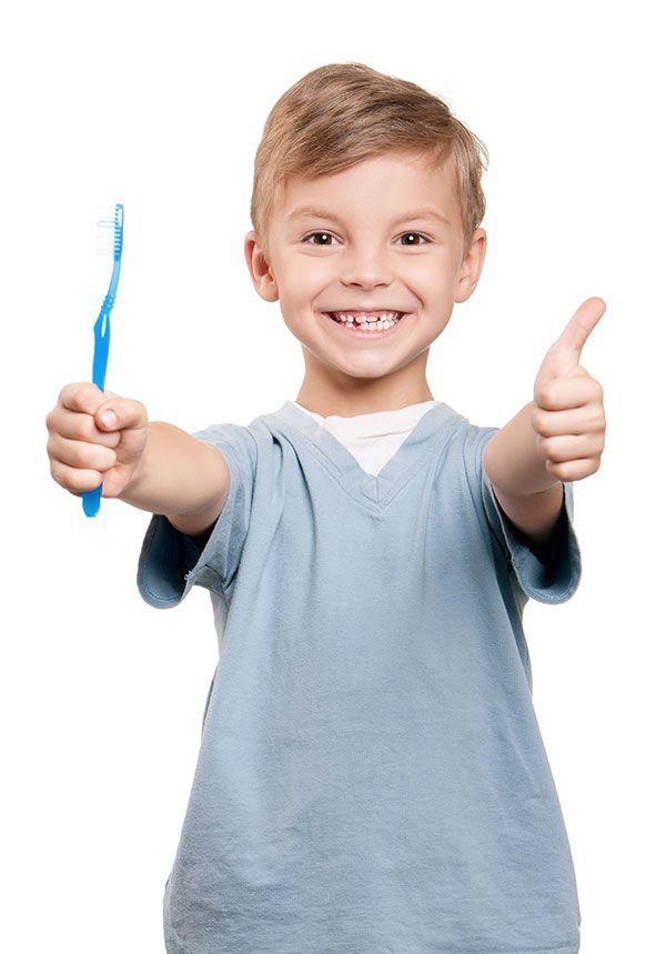 boy smiling with toothbrush