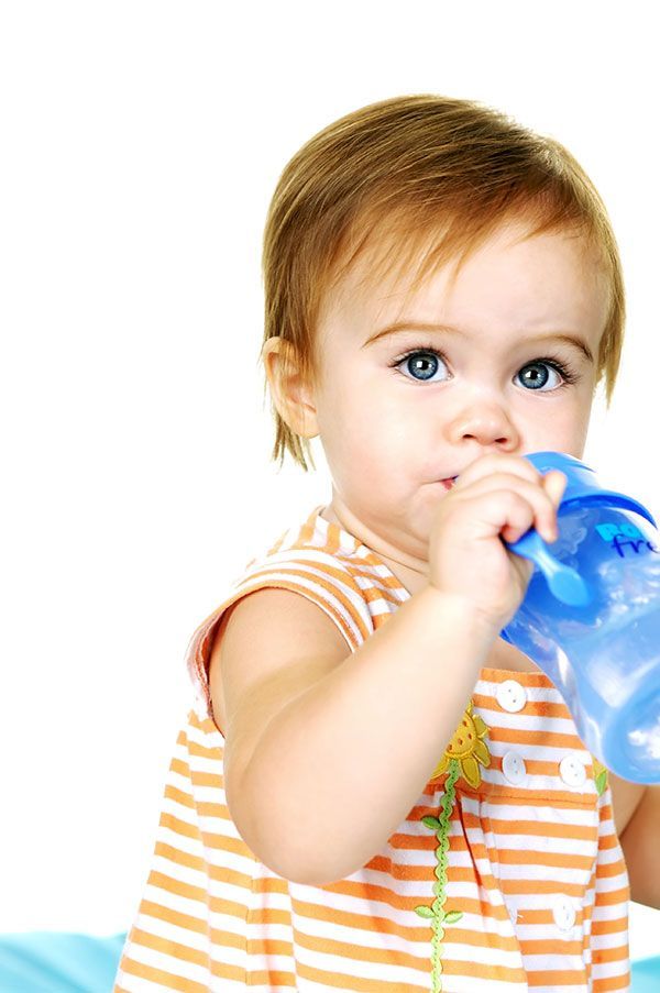 toddler drinking from sippy cup