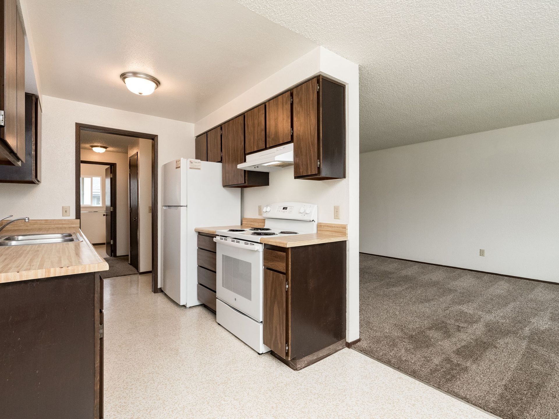 Southridge Apartments 2Bed/1Bath kitchen with view of dining and living room.