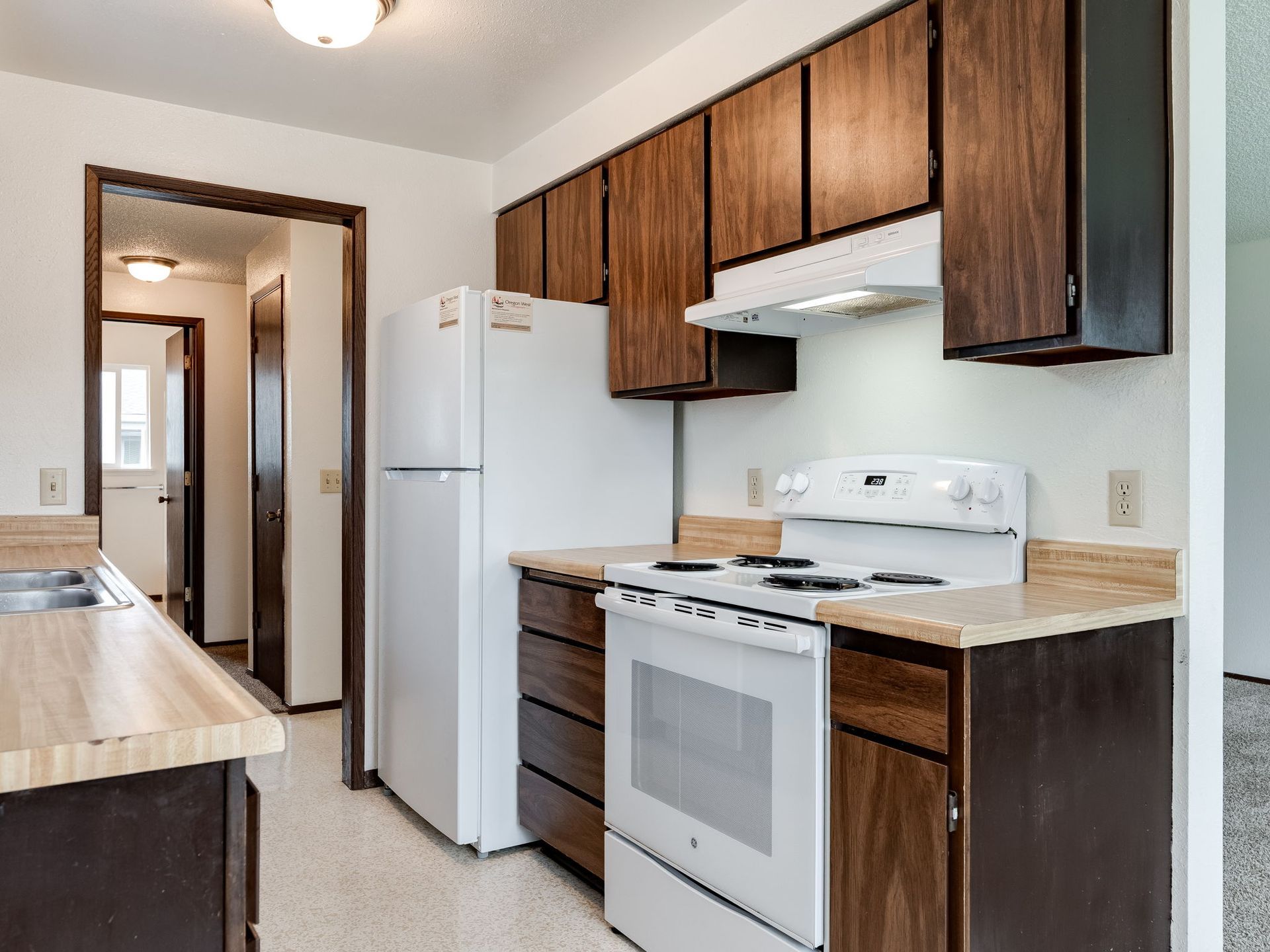 Southridge Apartments 2Bed/1Bath kitchen with refrigerator and range.