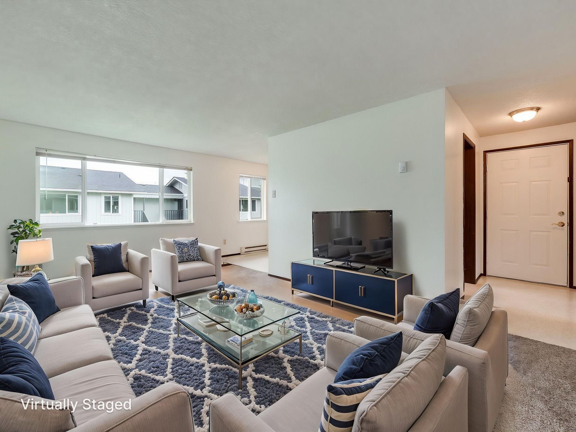 Southridge Apartments 2Bed/1Bath spacious living room with view of large window virtually staged.