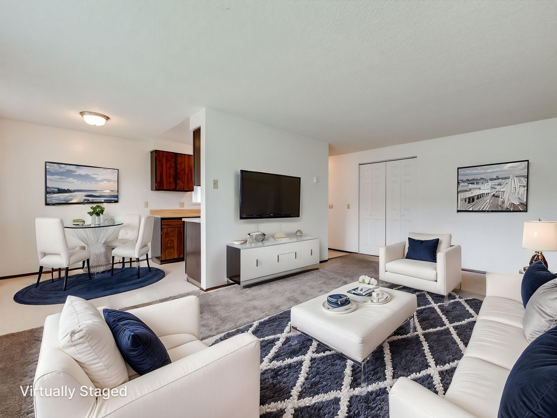 Southridge Apartments 2Bed/1Bath spacious living room with view of dining room virtually staged.