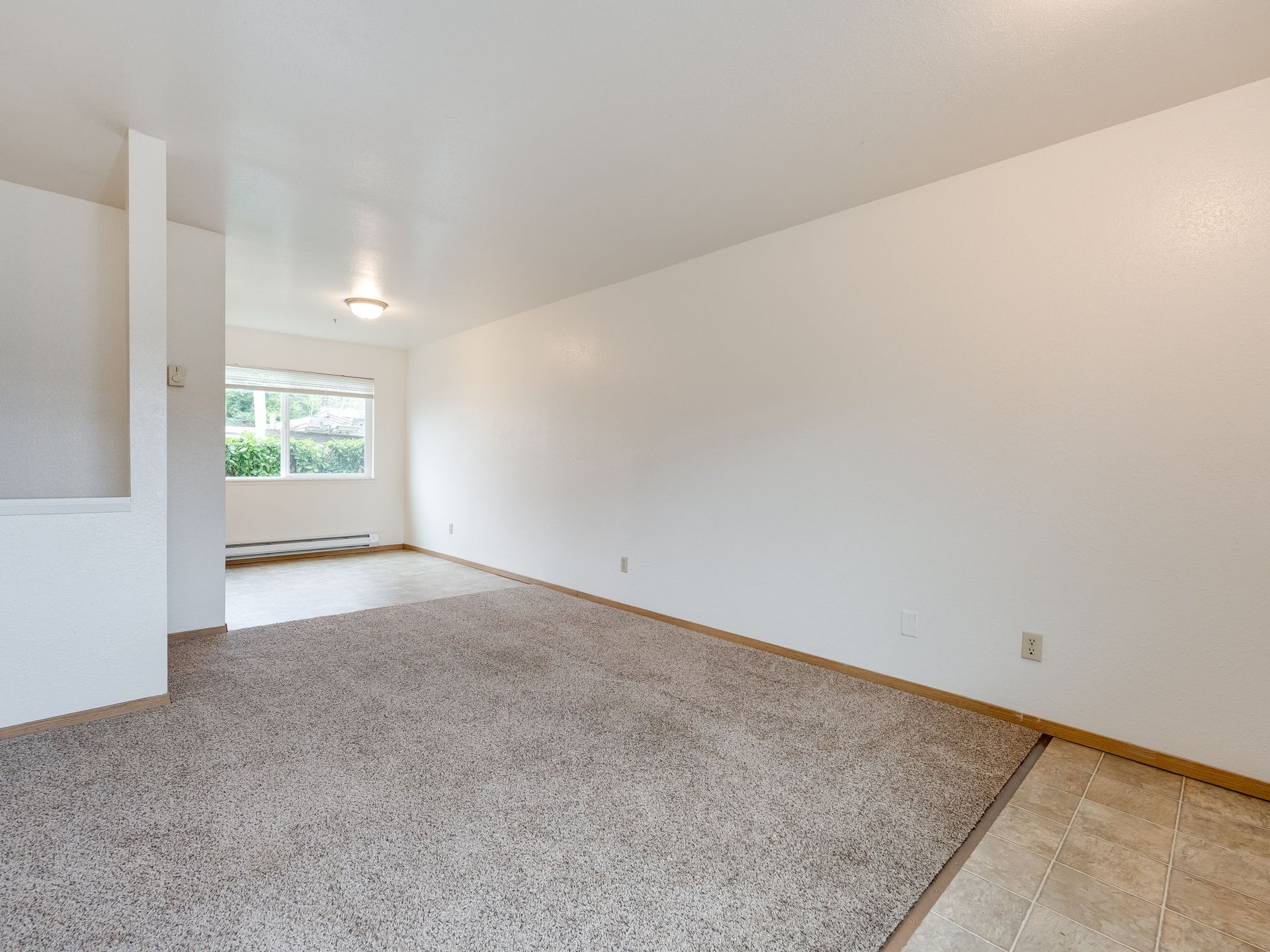 Southridge Apartments Townhome spacious living room leading into dining room.