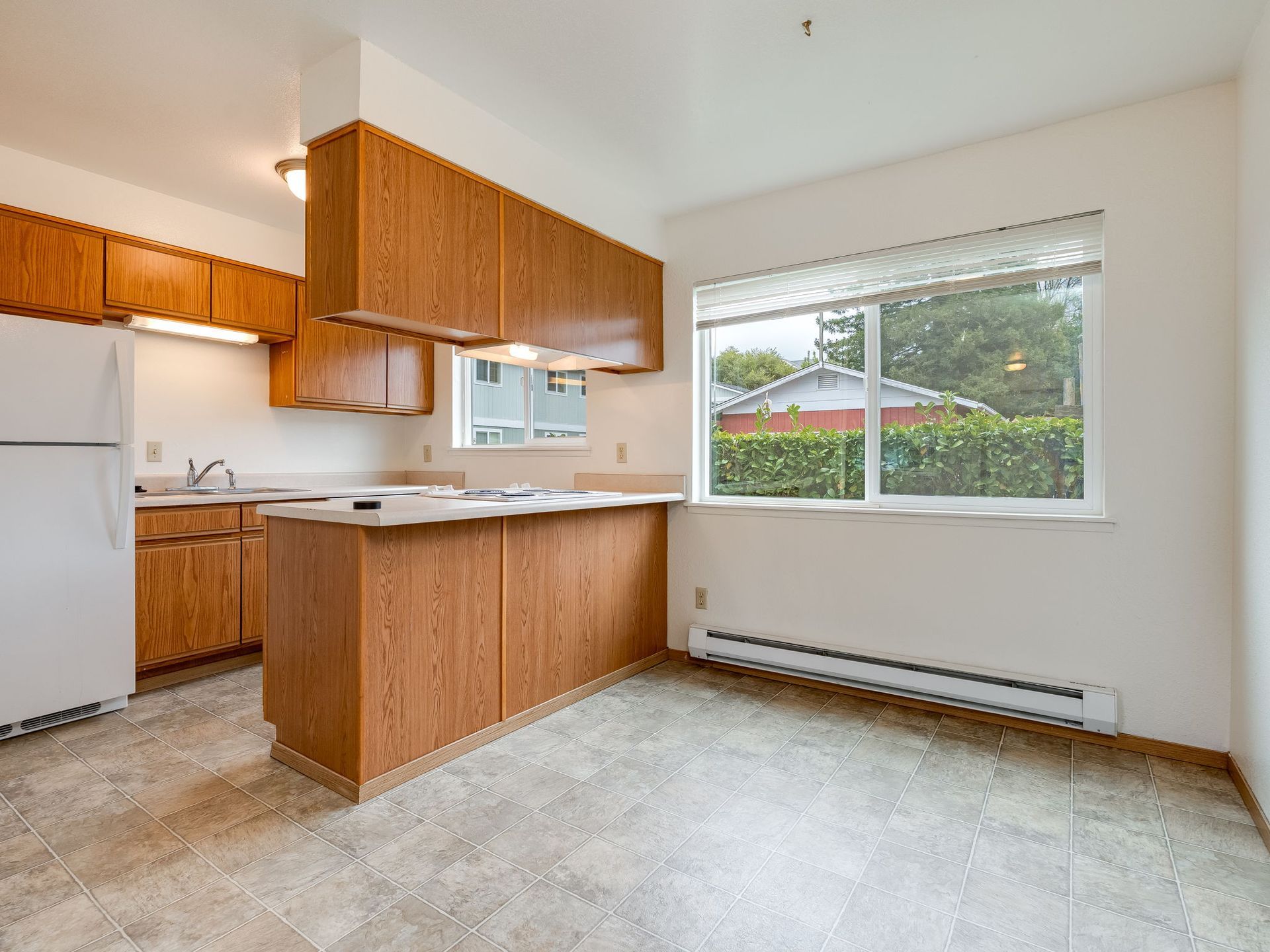 Southridge Apartments Townhome dining room with view of kitchen.