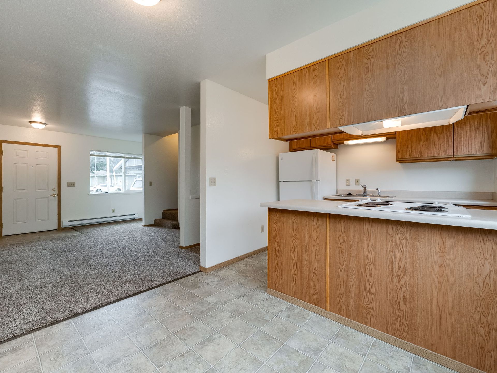 Southridge Apartments Townhome dining room with view of kitchen and living room.