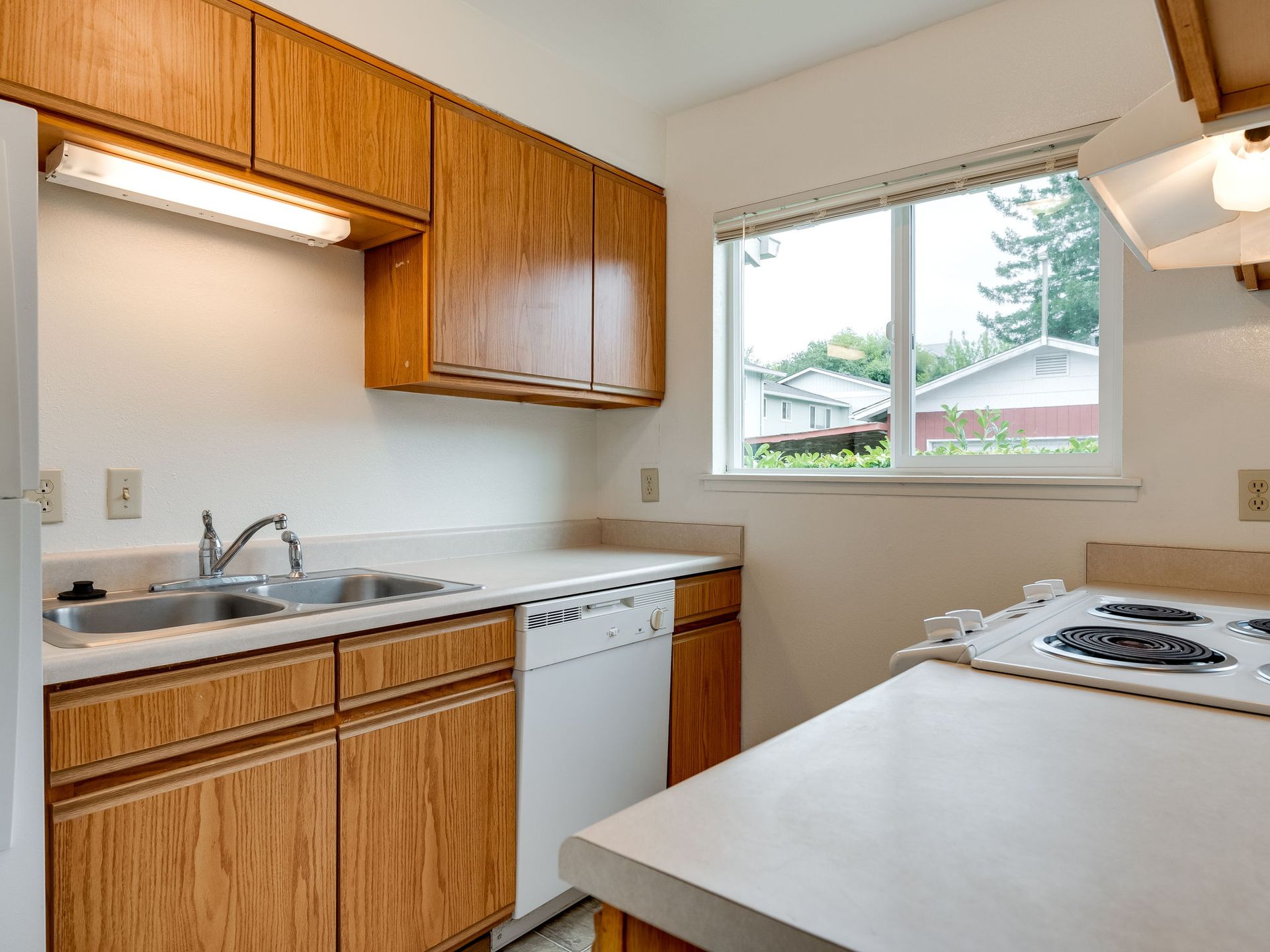 Southridge Apartments Townhome kitchen with view of sink and dishwasher.