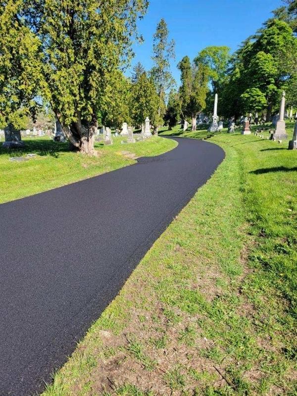 A Road Going Through A Cemetery With Trees On Both Sides | Manilla, IN | Floyd Crim & Sons Paving