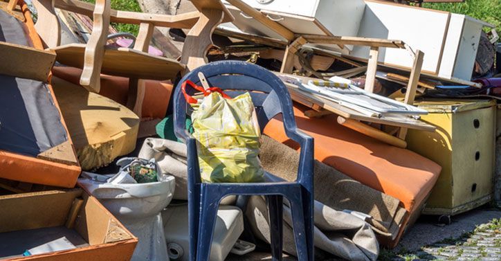 Wooden debris at the yard, boards and plates, and other junk being removed in the Clayton, NC area