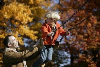 Father and son Play swing - Foster Care Training Process Independence, OH