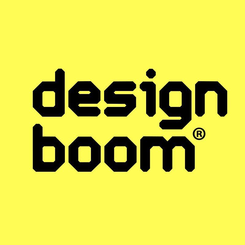 A yellow background with black text that says design boom