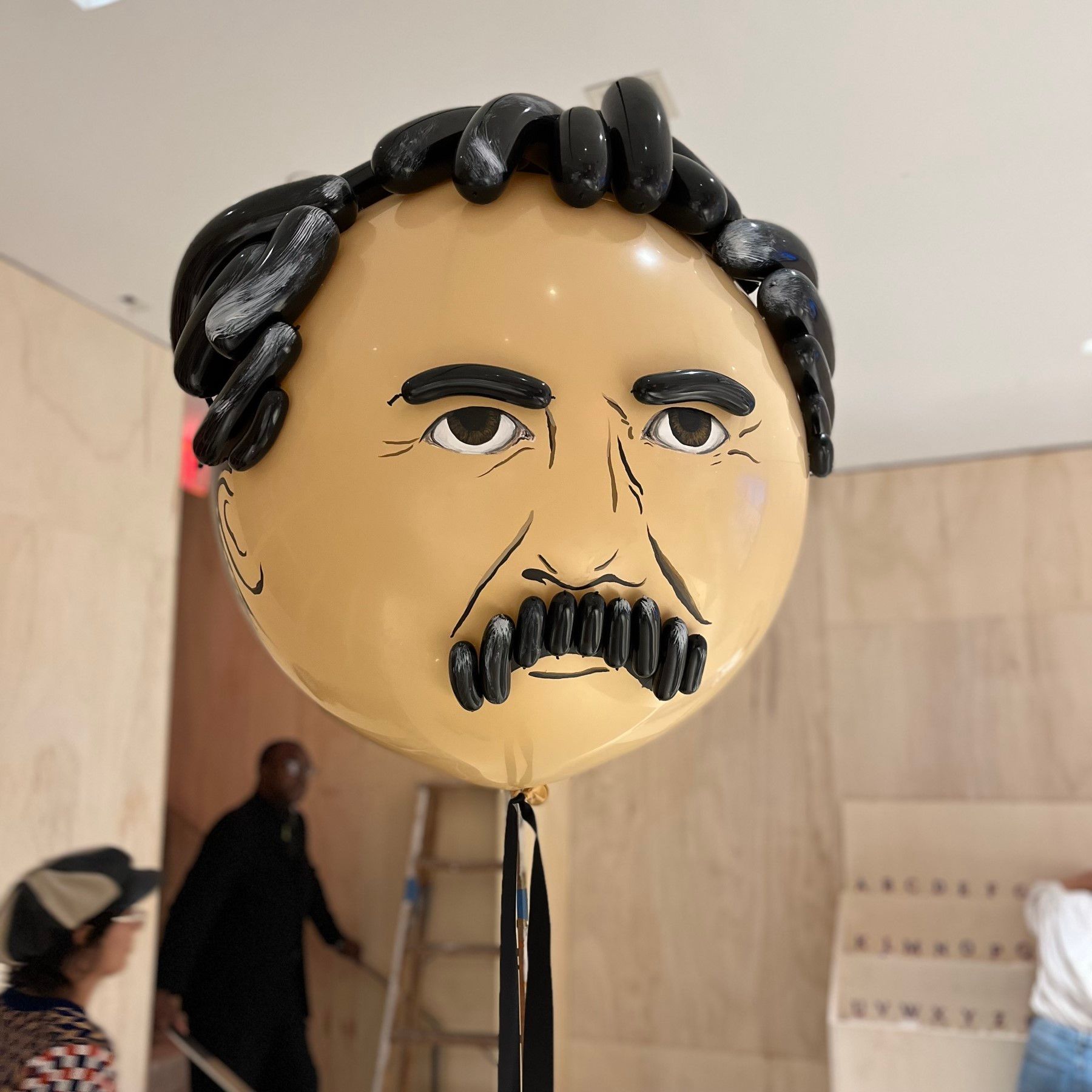 A balloon with a man 's face painted on it