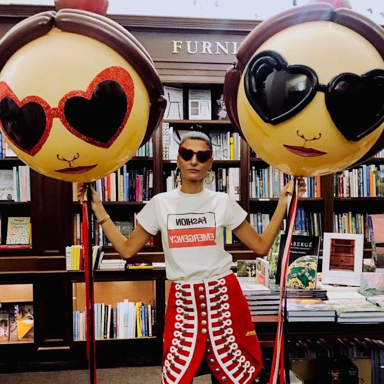 A woman wearing sunglasses and a t-shirt that says tomorrow