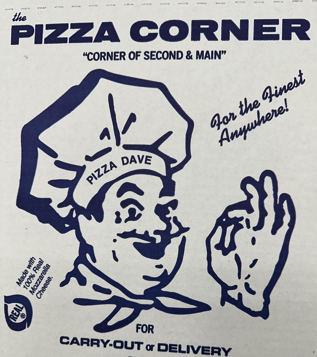 Blue and white Pizza Corner logo with chef 
