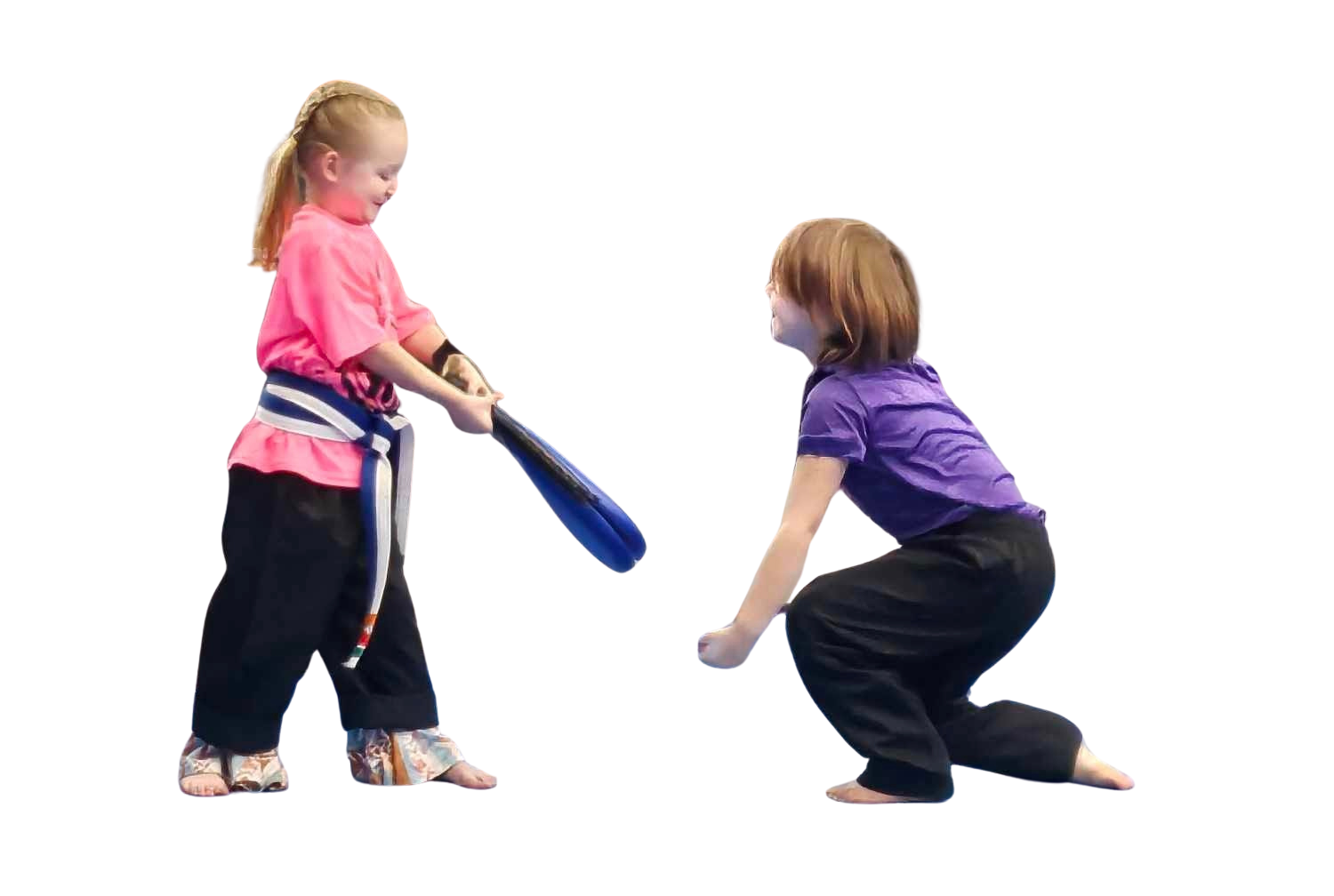 A boy and a girl are practicing karate together.