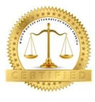 A gold seal with a scale of justice inside of it.