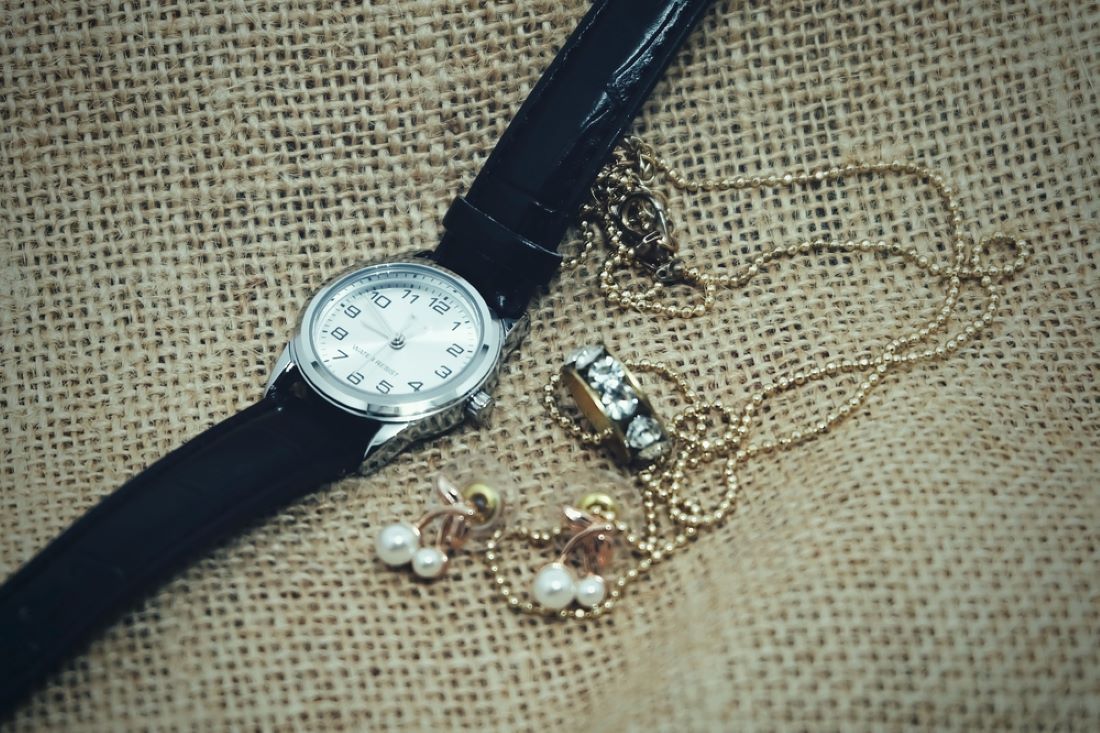 A Watch , Earrings , Necklace and Bracelet Are on a Table — Coastal Clocks & Watches in Buddina, QLD
