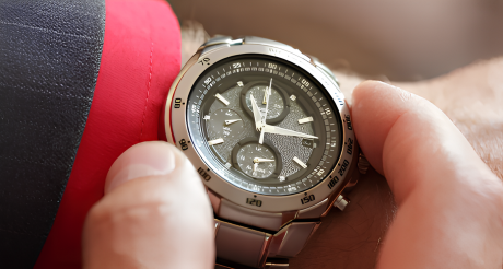 A Person is Adjusting a Watch on Their Wrist — Coastal Clocks & Watches in Buddina, QLD