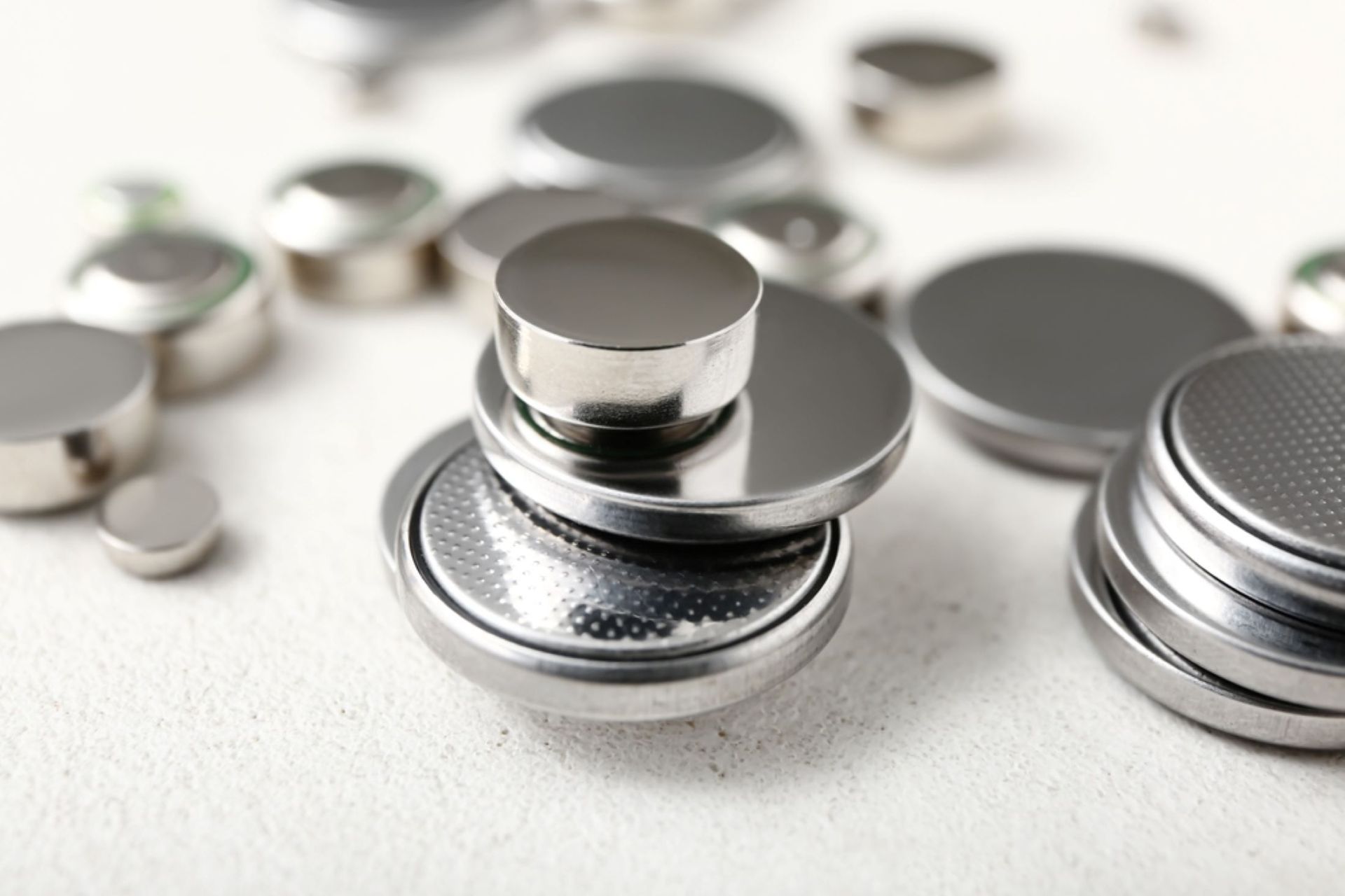 A Pile of Batteries Stacked on Top of Each Other on a Table — Coastal Clocks & Watches in Buddina, QLD