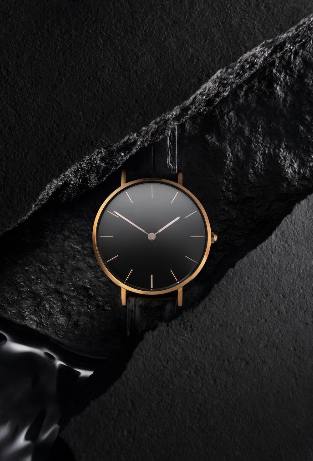 A Black and Gold Watch on A Black Background — Coastal Clocks & Watches in Buddina, QLD