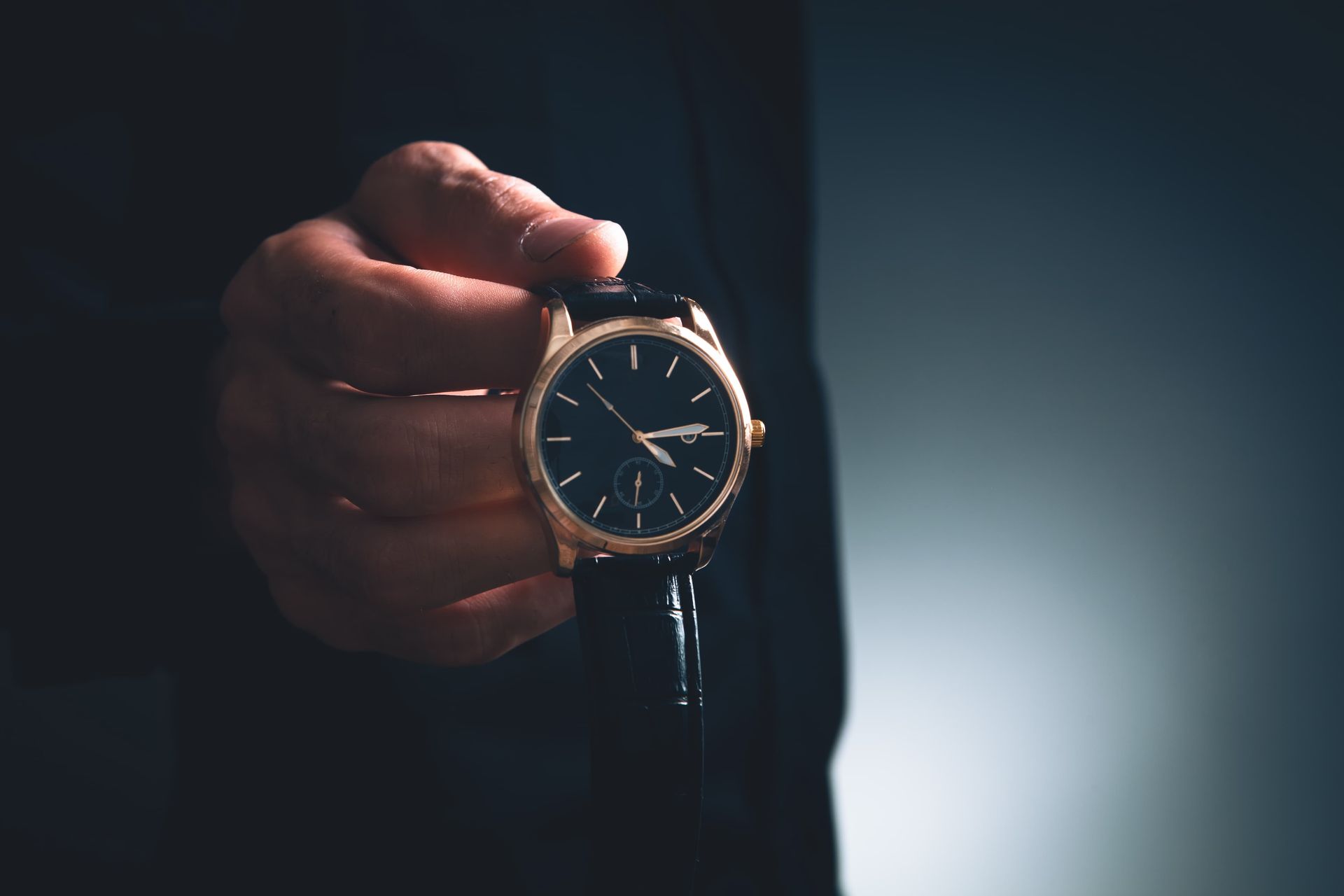 A Person Is Holding a Watch in Their Hand — Coastal Clocks & Watches in Buddina, QLD