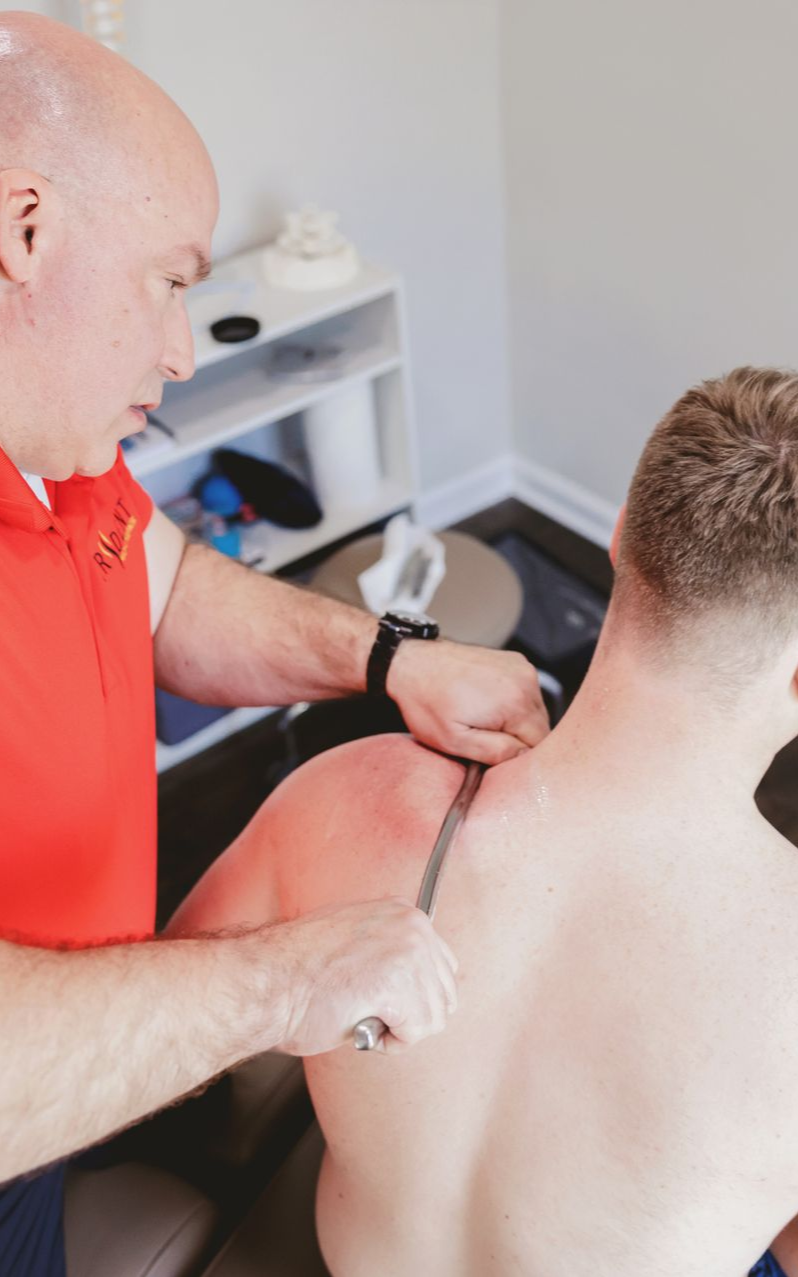 Chiropractor treating patient.
