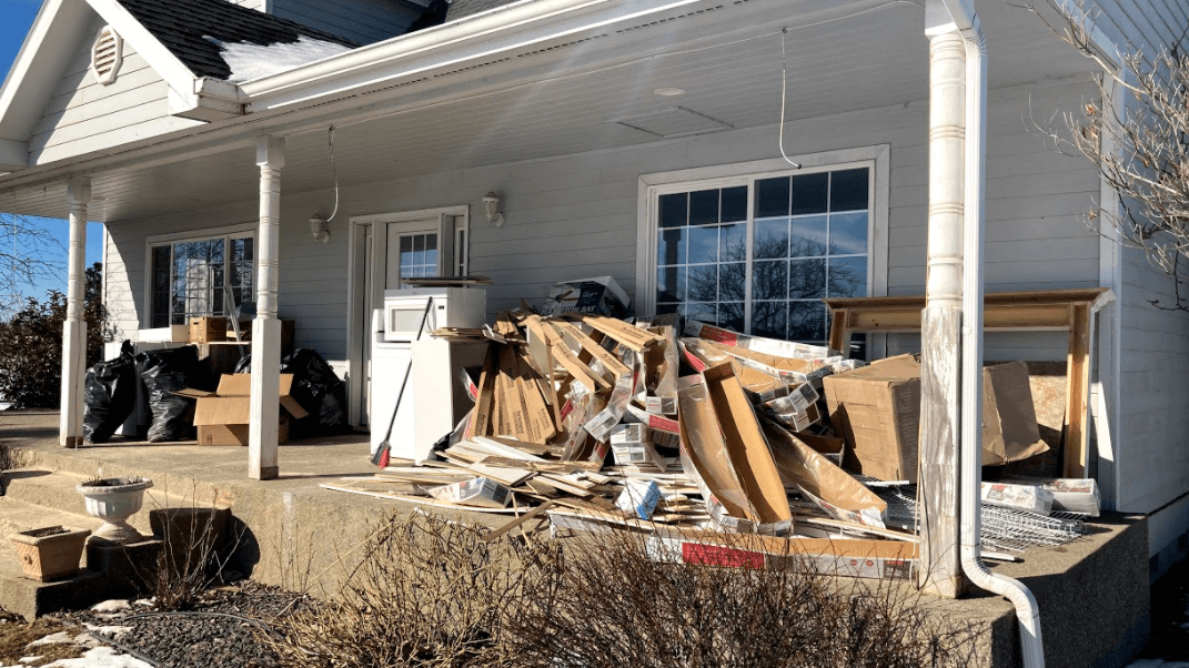 Fleur de Lis Junk Removal & Debris Hauling onsite removing junk from a customers home