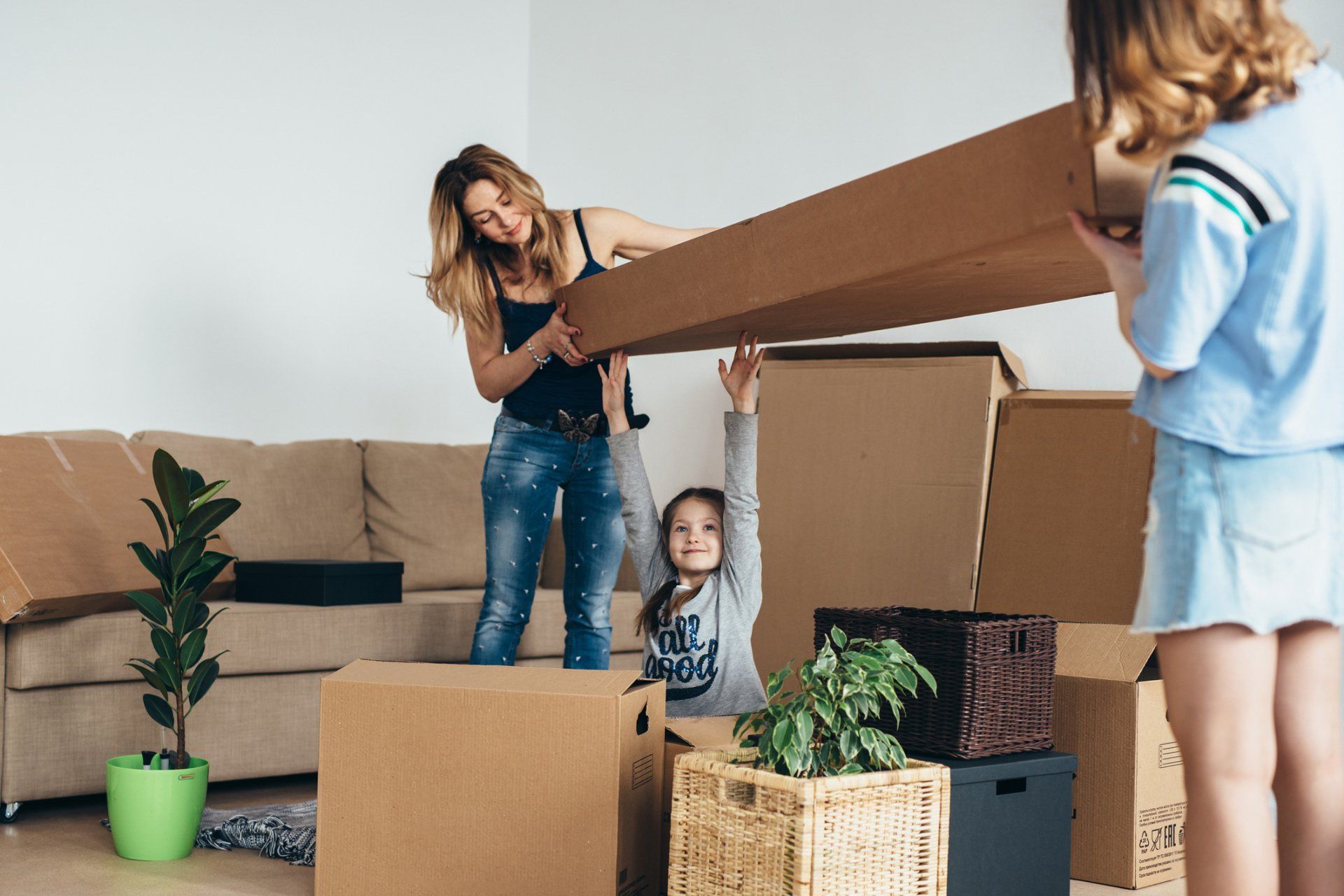 Family With Cardboard Boxes - Yaphank, NY - Certified Van Service