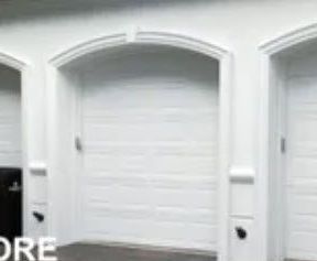 A Before Picture of A Garage with Arched Garage Doors and A Basketball Hoop.