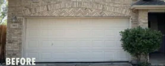 A Before Picture of A White Garage Door on A Brick House.