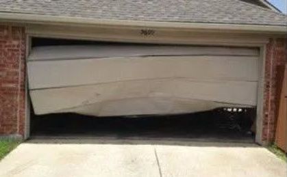 A Garage Door that Has Fallen Off of A House.