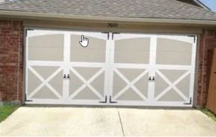 A Picture of A Garage Door with A Hand Pointing at It.