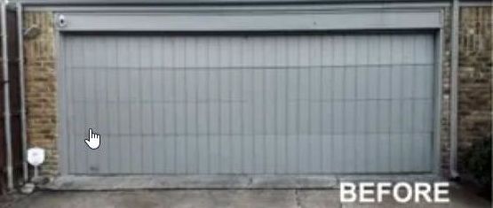 A Picture of A Garage Door Before Being Painted Dirty White