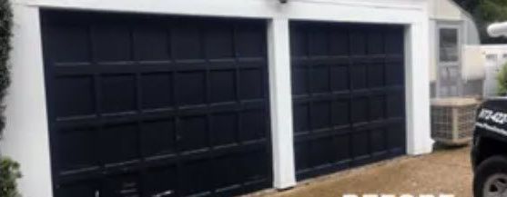 A Picture of A Garage Door Before Being Painted Black.