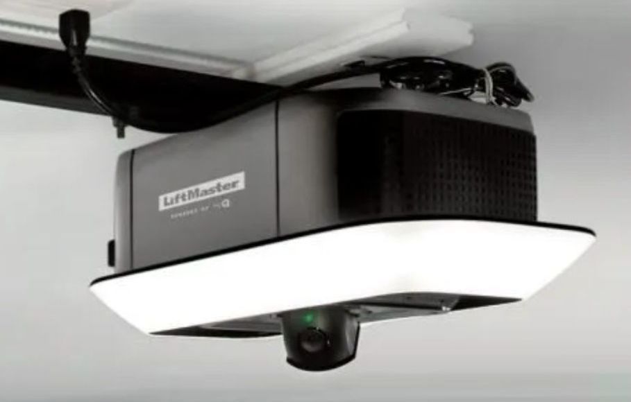 A Liftmaster Model 87504 garage door opener with a camera attached to it.