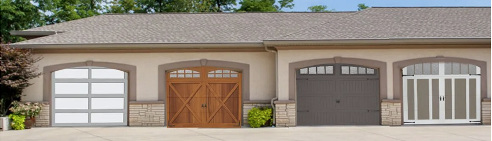 Three garage doors are lined up in front of a house.