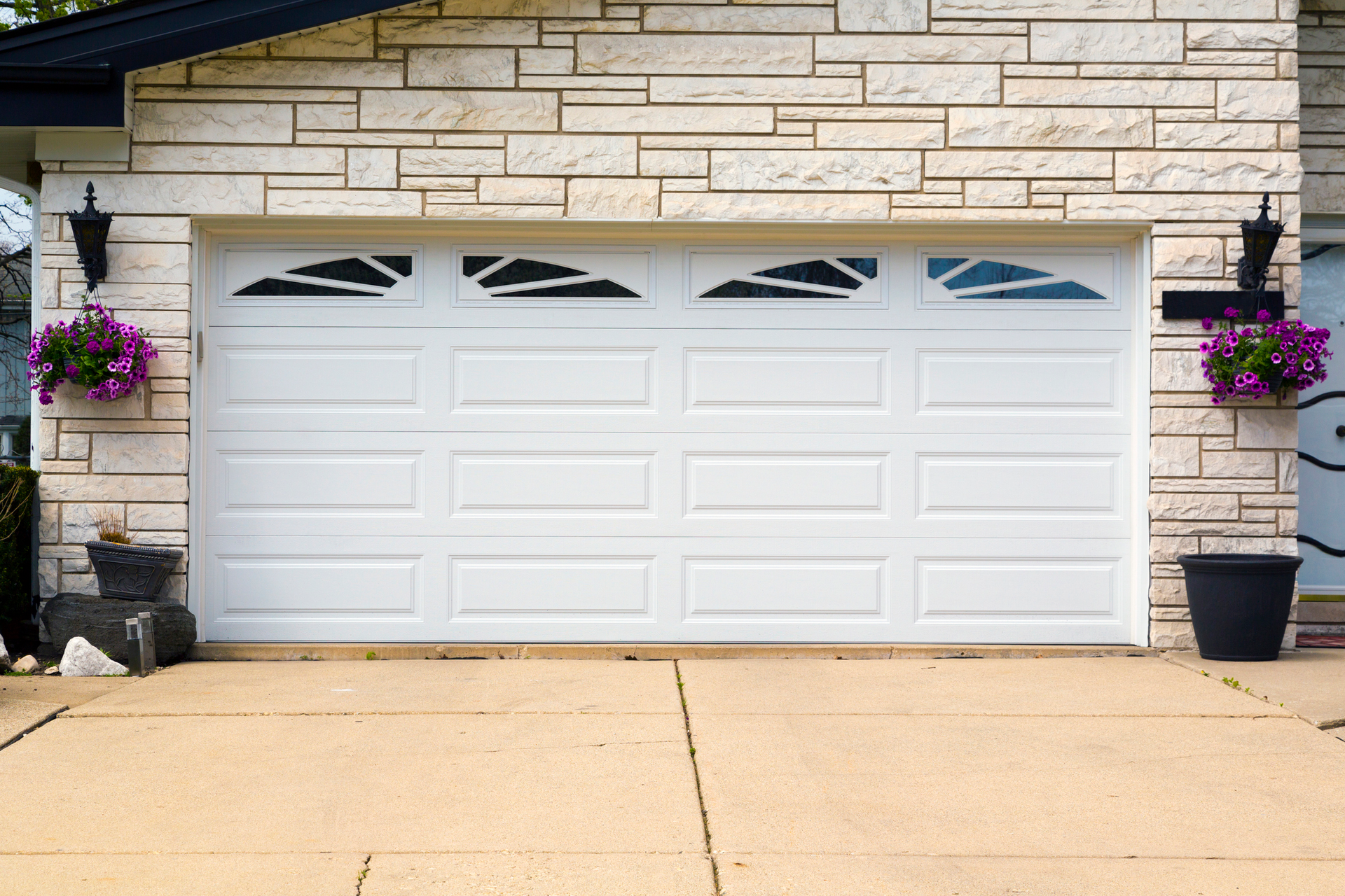 Residential garage door showcasing garage door installation services with modern design and style.