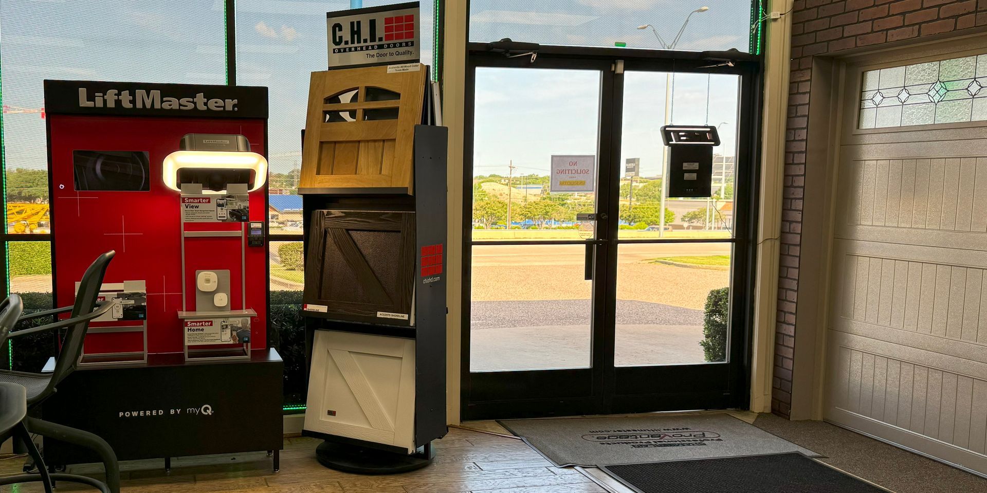 Showroom garage door opener and garage door wooden panel displays.