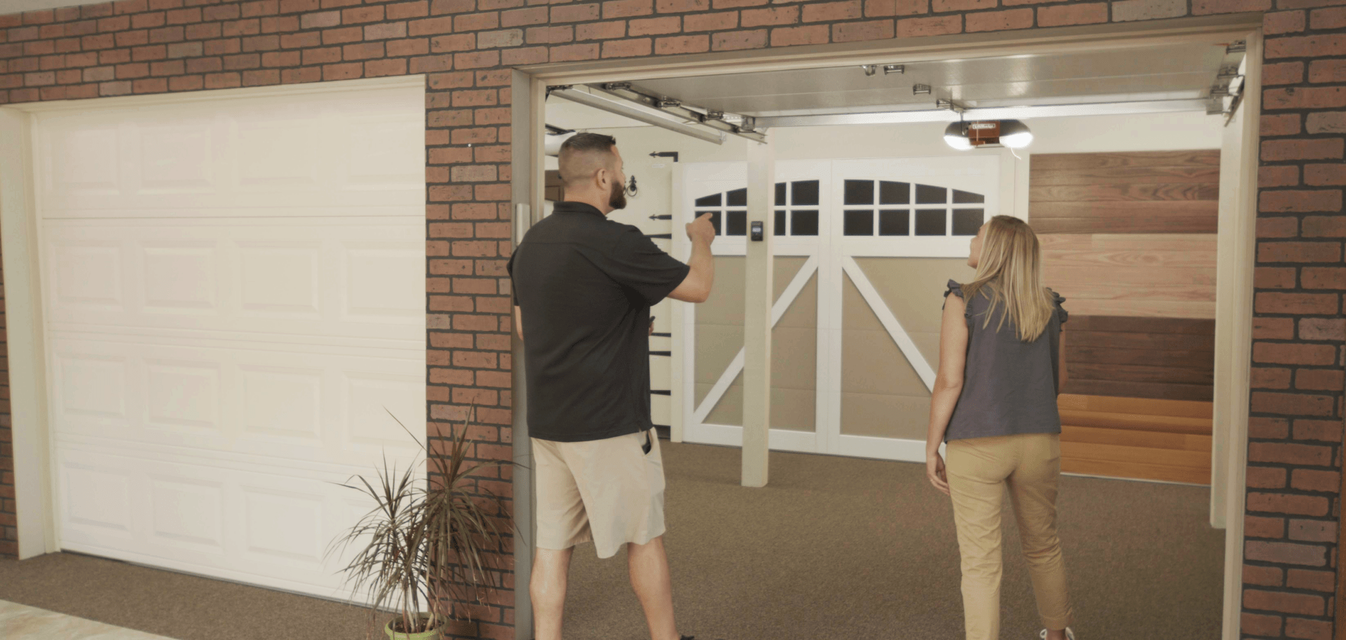 A professional staff member showing details about the Garage Door